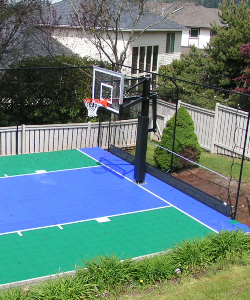 Pro Series Basketball Goal - Installed on a green and blue outdoor basketball court